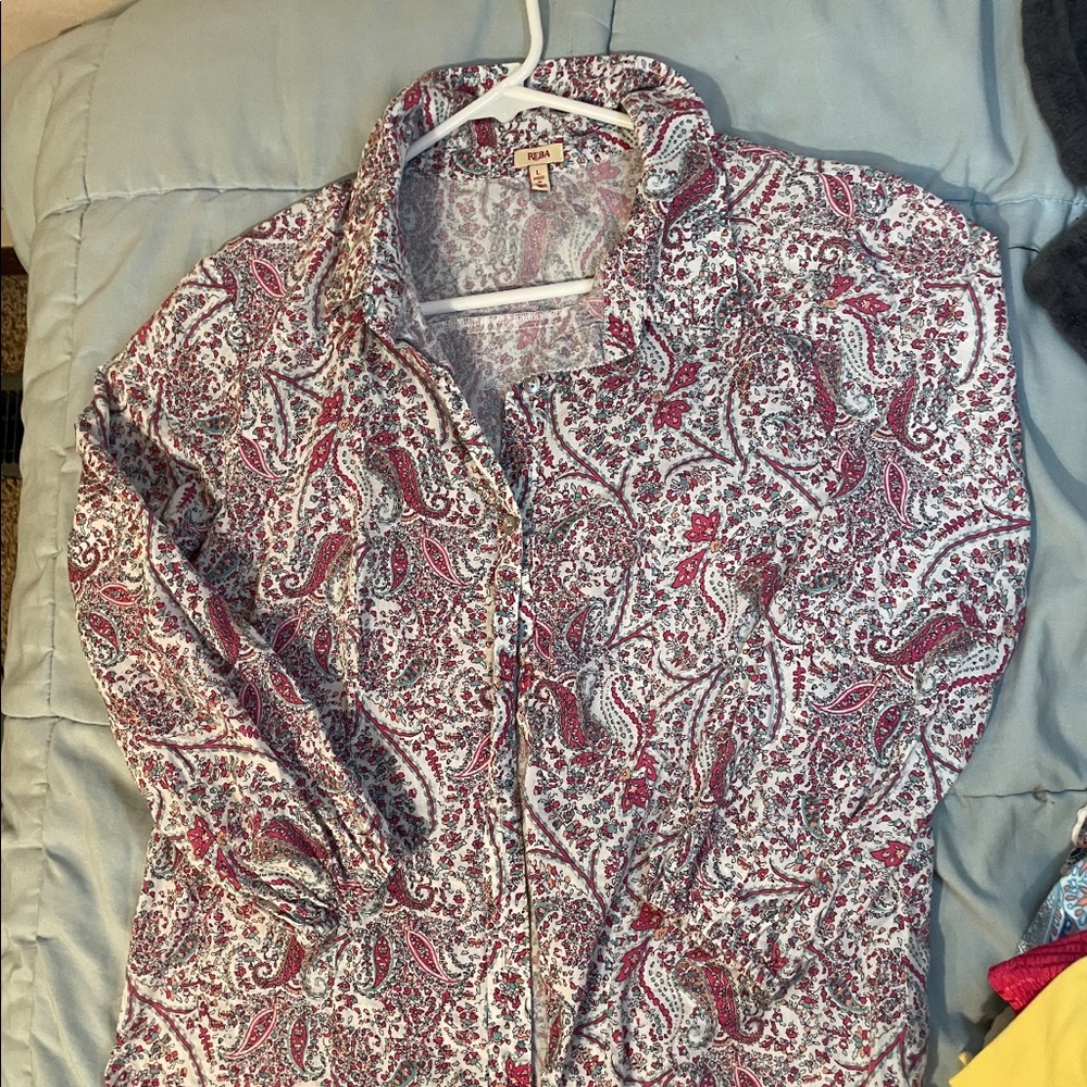 It’s a long sleeve button up. Brand is Reba.